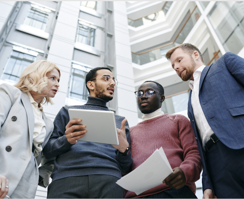 professionals collaborating outside office building