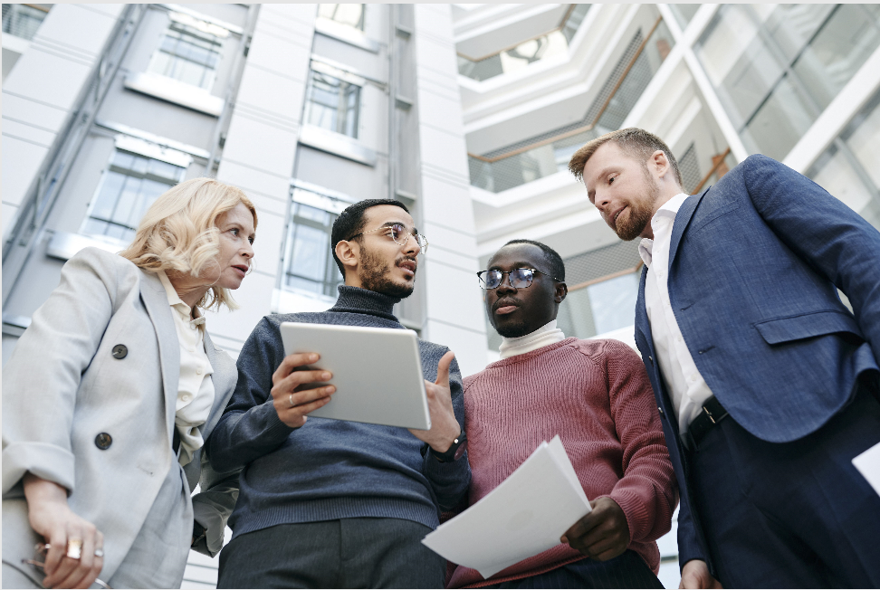 professionals collaborating outside office building